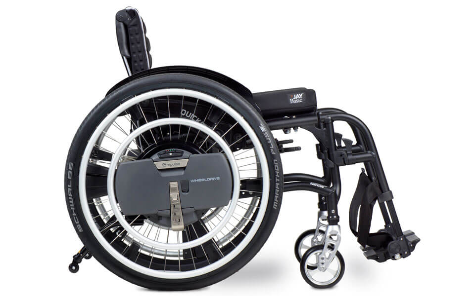 Who benefits from the WheelDrive electric wheelchair drive?